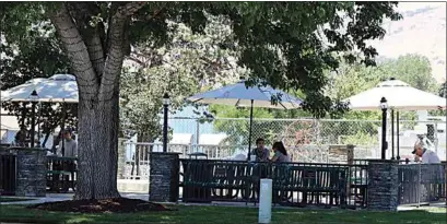  ?? CITY OF TEHACHAPI ?? The city of Tehachapi has added umbrellas to the tables at Railroad Park, giving people a shaded spot to enjoy meals.