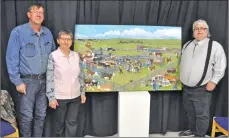  ??  ?? Swift Current residents Vincent and Florence Flaterud (at left) and Central Butte artist William Philpott stand with the painting during their meeting at the Art Gallery of Swift Current, Oct. 15.