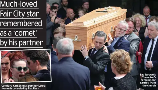  ??  ?? Comfort: Karl Shiels’s partner Laura Honan is consoled by Rex Ryan Sad farewell: The actor’s remains are carried from the church
