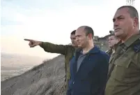  ?? (Ariel Hermoni/Defense Ministry) ?? DEFENSE MINISTER Naftali Bennett is briefed by senior officers in the Golan Heights last month.