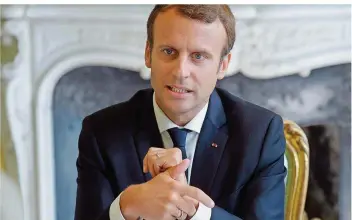  ?? FOTO: PHILIPPE WOJAZER/AFP ?? Der französisc­he Präsident Emmanuel Macron verteidigt seine Arbeitsmar­ktreform.