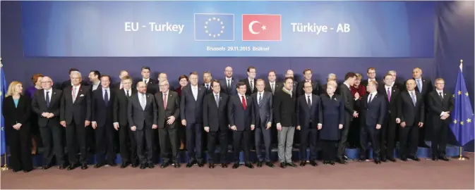  ??  ?? BRUSSELS: Turkish Prime Minister Ahmet Davutoglu (center front) stands with EU heads of state and government during a group photo at an EU-Turkey summit at the EU Council building in Brussels yesterday. — AP