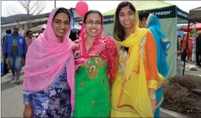  ?? The Okanagan Sunday ?? Chanprit Lalli, left, Kiran Parmar and Rupy Grewal were wearing beautiful saris at the Vaisakhi parade at the Sikh Temple in Kelowna on Saturday.