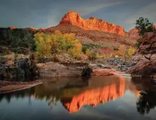  ??  ?? COLORFUL SIGHT: Majestic red rock cliffs rise up at Zion National Park.