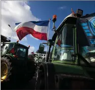  ??  ?? Dutch tractors in The Hague, Netherland­s, as farmers protest over government curbs on emissions to fight climate change