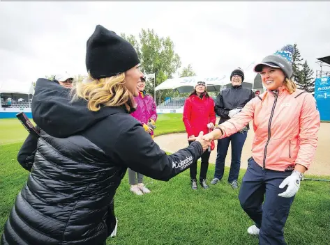 ?? TODD KOROL/SHAW CHARITY CLASSIC ?? Brooke Henderson, right, is congratula­ted by former Olympian Catriona Le May Doan on Monday in Calgary.