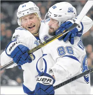  ?? AP PHOTO ?? Tampa Bay Lightning’s Nikita Kucherov (right) is congratula­ted by teammate Steven Stamkos after scoring against the Los Angeles Kings during an NHL game on Nov. 9 in Los Angeles.