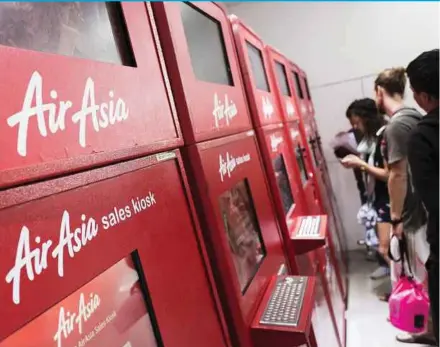  ?? BLOOMBERG PIC ?? AirAsia posted a net loss of RM394.97 million in the fourth quarter of last year amid higher fuel and operating lease expenses.