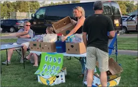  ?? JOHN WORTHINGTO­N — MEDIANEWS GROUP ?? Pennridge FISH held a “Pantry in the Park” food drive during the concert, collecting nonperisha­ble and back-to-school items.