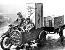  ??  ?? Dressed for all weathers, the crew of this outfit and trailer press on with an export delivery for Chater-Lea. The upright box is labelled ‘Sydney’, so there was still a fair way for the products to go!