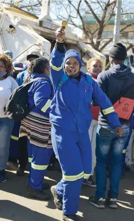  ?? Picture: Neil McCartney ?? TOYI-TOYI. Waste workers in Ekurhuleni during a strike over working conditions in Palm Ridge last year.