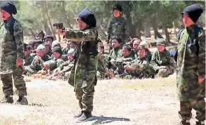  ??  ?? Danger zone: Propaganda footage by IS showing children undergoing training in Iraq and Syria.