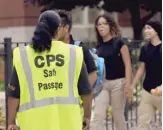  ?? SUN-TIMES FILES ?? A Safe Passage worker watches students arrive on the first day of school in 2016 at Kelvyn Park High School.