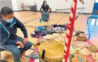  ??  ?? Drums are laid out in the gymnasium for students who cannot attend the fall feast at Gaagagekii­zhik, an Ontario’s first Anishinaab­e immersion school.