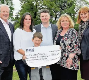  ??  ?? Handing over the cheque for £8,435.49 to Lynda Ellis, New Star charity administra­tor, are Greenbank chair of trustees John Kennedy, Lyndsey Aizelwood, George Aizelwood, Mark Aizelwood and Jane Lowe