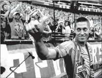 ??  ?? Clint Dempsey greets fans after he was introduced as the newest member of the Seattle Sounders FC MLS soccer team Aug. 3, 2013, in Seattle. Playing its 19th season and preparing for an expansion to 24 teams in its post-David Beckham era, MLS has grown...