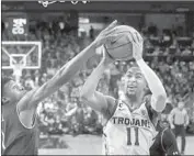  ?? Mark J. Terrill Associated Press ?? JORDAN McLAUGHLIN is averaging 12.3 points, 7.7 assists and 2.0 steals for the Trojans.