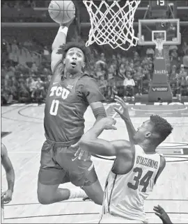  ?? Mark J. Terrill Associated Press ?? IT LOOKS LIKE a sure two points, but TCU’s Kaden Archie missed this dunk attempt in the second half at Staples Center as USC’s Victor Uyaelunmo defends.