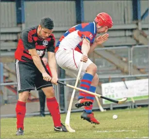  ??  ?? Oban Camanachd’s Matt Rippon clears his lines during the premiershi­p match against Kingussie at Mossfield which the red and blacks won 2-2.