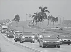  ?? AL DIAZ, AP ?? Traffic heads north along the Florida Turnpike near Homestead, as tourists in the Florida Keys evacuate Wednesday. Hurricane Irma is on its way to a possible hit on South Florida.