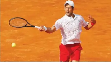  ?? Reuters ?? ↑
Novak Djokovic plays a backhand against Casper Ruud (unseen) during their semi-final match of the Italian Open in Rome on Sunday.