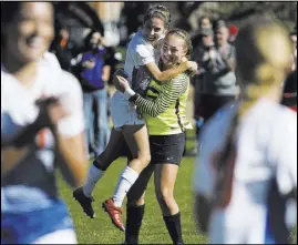  ??  ?? Bishop Gorman players Jaden Terrana, left, and Hannah Lee celebrate their 3-2 victory against Arbor View in the Class 4A Sunset Region girl’s soccer championsh­ip game Saturday at Bettye Wilson Soccer Complex.