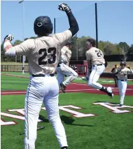  ?? (Photo by Bill Owney/ Texarkana Gazette) ?? Pleasant Grove's varsity baseball team celebrates Saturday against Pittsburg in Atlanta, Texas.