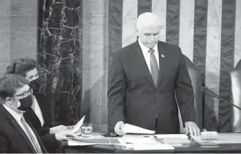  ?? JIM LO SCALZO/AP ?? Vice President Mike Pence officiates as a joint session of Congress convenes to confirm the Electoral College votes cast in November and formally declare President-elect Joe Biden’s victory over President Donald Trump.