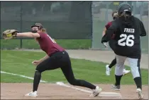  ??  ?? Birmingham Seaholm first baseman Leah Mclain gets the put out as Bloomfield Hills’ Hayden Freed stretches for first base during the double header played on Monday.