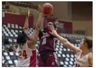  ?? (Photo courtesy UALR Athletics) ?? UALR’s Krystan Vornes takes a shot over a Louisiana-Monroe defender Saturday during the Trojans’ 67-42 victory over the Warhawks at the Jack Stephens Center in Little Rock. Vornes finished with a career-high 23 points and also had 11 rebounds.