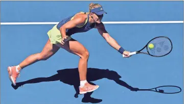  ?? Andy Brownbill / AP ?? Angelique Kerber reaches for a return to compatriot Anna-Lena Friedsam during their first round match at the Australian Open.