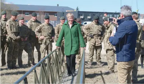  ?? — Reuters ?? Nato deputy Secretary-General Rose Gottemoell­er crosses mobile temporary bridge at military base in Tapa, Estonia, on Friday.