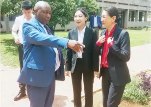  ?? ?? Energy and Power Developmen­t Minister Edgar Moyo (left) converses with Shandong Dingneng New Energy Co Ltd chairman, Liu Lining (right) and her assistant Liu Ziqi (centre) during a meeting on energy in Harare yesterday. — Picture: Edward Zvemisha