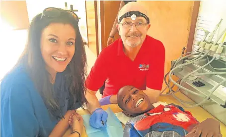  ??  ?? Proceeds from Elaine’s fundraisin­g helped send retired dentist Stuart to provide treatment in Cape Verde.