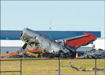  ?? LM Otero The Associated Press ?? Debris from the Boeing B-17 Flying Fortress and Bell P-63 Kingcobra that collided during an air show at Dallas Executive Airport is shown in Dallas on Saturday.