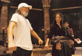  ?? Village Roadshow Pictures Asia ?? “JOURNEY TO THE WEST: Conquering the Demons” is close to grossing more at China’s box office than any other Chinese-made film in history. Above, director Stephen Chow, left, and star Shu Qi.