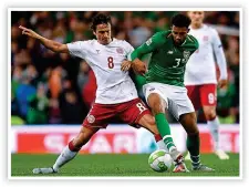  ??  ?? STRUGGLE: Both Matt Doherty (main, with Jens Stryger Larsen) and Cyrus Christie (inset, with Denmark’s Thomas Delaney) both found the going tough in the Nations League last night