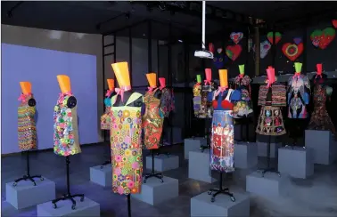  ??  ?? An overview of a decade’s worth of work at Manish Arora’s new creative design studio in Chhatarpur, New Delhi. (R) Arora’s latest collection, “Orange is the new Zen”, at Paris Fashion week.