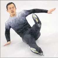  ?? THE CANADIAN PRESS/AP-BERNAT ARMANGUE ?? Patrick Chan of Canada falls while performing in the men’s short program figure skating in the Gangneung Ice Arena at the 2018 Winter Olympics in Gangneung, South Korea, Friday. Chan could feel the troublesom­e jump get away from him before his blades...