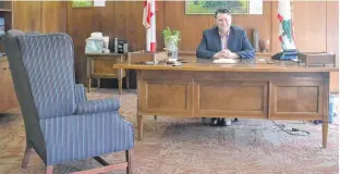  ?? STU NEATBY/THE GUARDIAN ?? Premier Dennis King is shown in his office on Friday. King and his cabinet are set to meet the legislatur­e on Tuesday, the first time since the beginning of the COVID-19 pandemic.