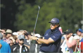  ??  ?? Phil Mickelson tees off on No. 17 at Pebble Beach during the third round. He’s a four-time champion at the event, more than anyone else except for Mark O’Meara, who was victorious five times.