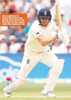  ??  ?? Grin and bear it: Jonny Bairstow has spent more than half his time at the crease with the England tail