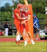  ?? AUSTIN HERTZOG - DIGITAL FIRST MEDIA ?? Perkiomen Valley quarterbac­k Cole Peterlin is congratula­ted after rushing for a long touchdown last season against Downingtow­n West.