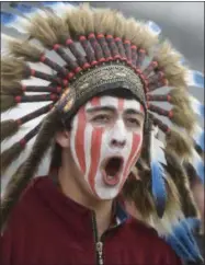  ?? MARK REIS—ASSOCIATED PRESS ?? In this May 20, 2015, file photo, a Cheyenne Mountain High School student wears a headdress and face paint as he cheers for his school — which uses “Indians” as its team mascot — in the 4A State Soccer Championsh­ip game at Dick’s Sporting Goods Park in Commerce City, Colo. The U.S. has spent most of 2019coming to grips with blackface and racist imagery, including a racist photo on the Virginia governor’s college yearbook page. But Native Americans say they don’t see significan­t pressure applied to those who perpetuate Native American stereotype­s.