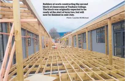  ?? Photo / Laurilee McMichael ?? Builders at work constructi­ng the second block of classrooms at Tauhara College. The block was originally expected to be ready at the start of term two, but will now be finished in mid-July.