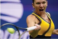  ?? The Associated Press ?? Simona Halep, of Romania, returns a shot to Kristina Kucova, of Slovakia, during the second round of the US Open Wednesday in New York.