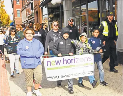  ?? File photo ?? More than 100 people walked a 1.5-mile loop downtown during the first Walk to End the Silence to raise awareness of domestic violence at HarborPark in Middletown in 2015. The procession was held in honor of 7-month-old Aaden Moreno, who lost his life July 5, 2015, in the Connecticu­t River.