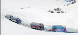  ?? ANI ?? Trucks stranded at Baralacha Pass on the Manali-Leh Highway on Wednesday.