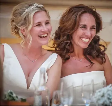  ?? ?? Reaching out: Emma, right, and Sharon — blissfully happy on their wedding day in 2016