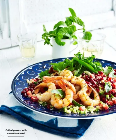  ??  ?? Grilled prawns with a couscous salad